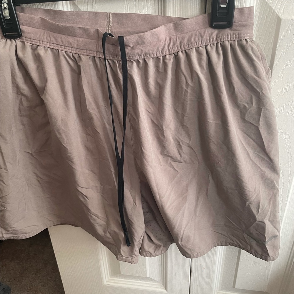 PAIR of NIKE DRYFIT shorts. Tan and Gray.